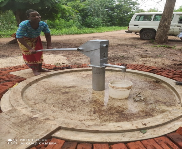 A woman drawing water